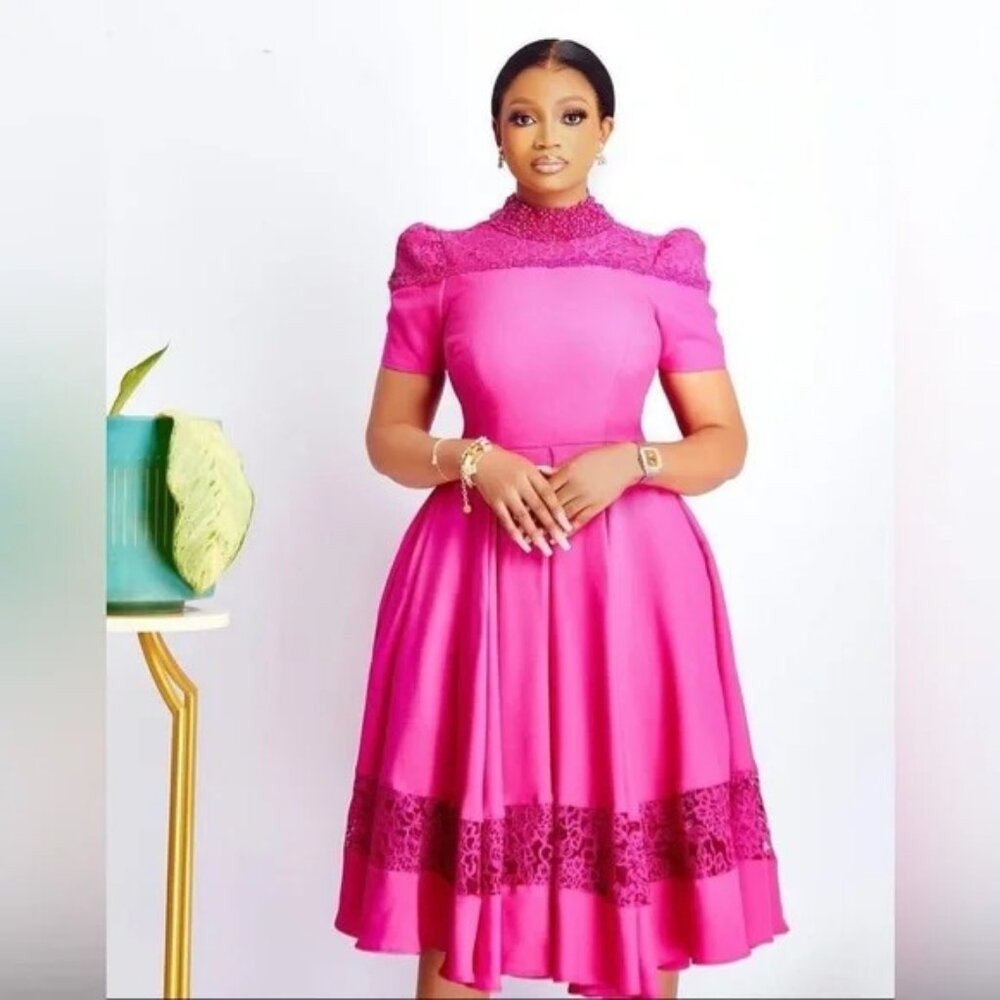 women's hot-pink fit-and-flare dress with lace hem.